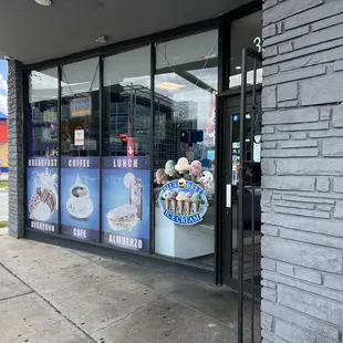 a storefront window with a stuffed animal