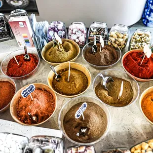 a variety of spices in bowls