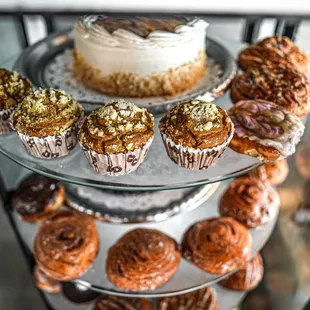 a display of pastries and cakes