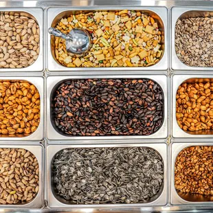 a variety of nuts in trays