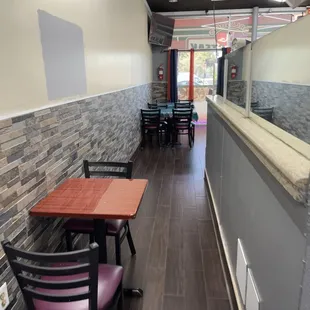 a restaurant with tables and chairs