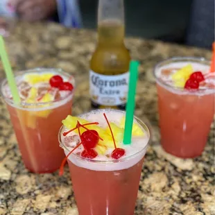 a close up of three drinks