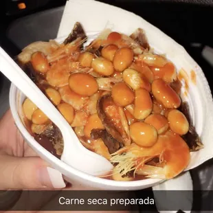 a person holding a bowl of food