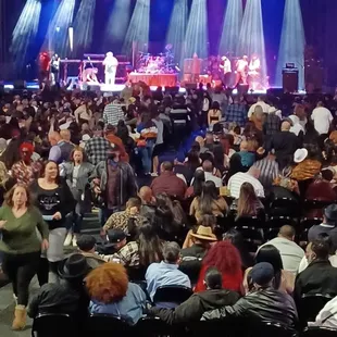 a large crowd of people sitting in chairs