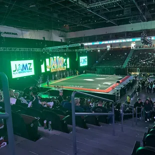 a crowd of people watching a professional tennis match
