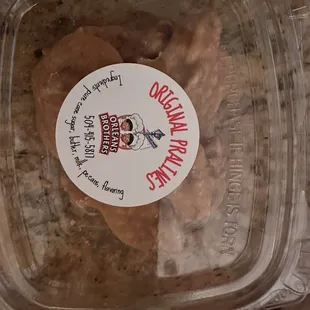 a close up of a cookie in a plastic container