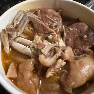 a bowl of soup with meat and vegetables