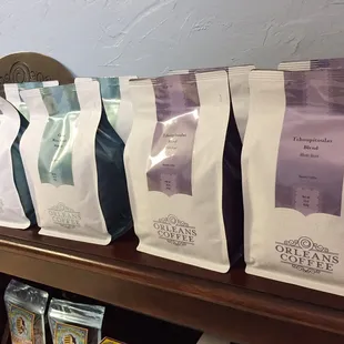 coffee bags lined up on a shelf