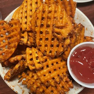 Bowl of Sweet Potato Fries, comes with ketchup, in a bowl that goes down pretty far, $10