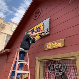 Orlando setting up our sign at our location in Eagle Pass.