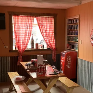 a picnic table and a soda cooler