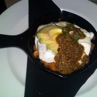 Chorizo and Potato hash skillet.  With over medium eggs and avacado.