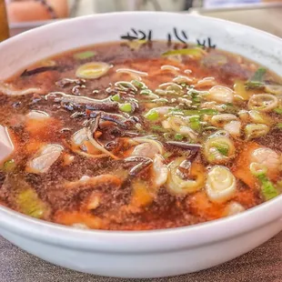 a bowl of ramen and chopsticks