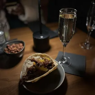 Duck confit taco and Prosecco