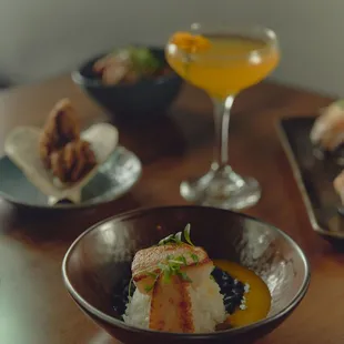 Assortment of dishes and Silk Road signature cocktail