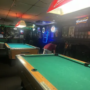 pool tables and neon signs