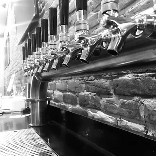 a row of beer taps