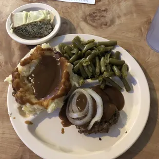 Lunch special, small plate, hamburger steak and lemon poppyseed cake.