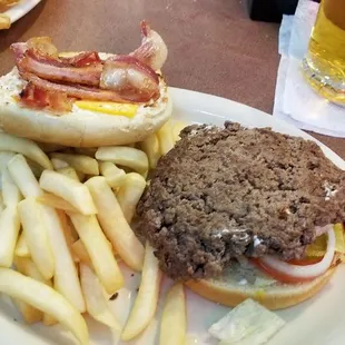 Bacon cheese burger with fries.