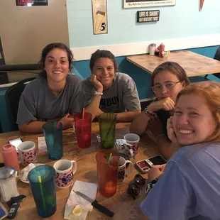 a group of people sitting at a table