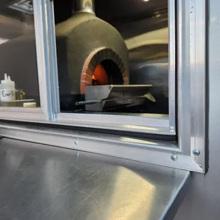 An authentic Mugnaini wood fired oven imported from Tuscany, Italy