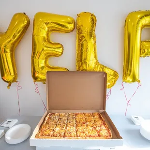 a box of pizza with the word yep spelled on it