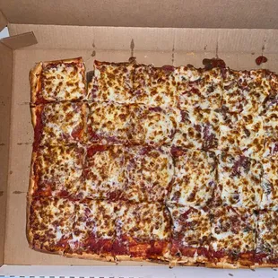 Full sheet pizza with 16 oz energy drink for scale lol
