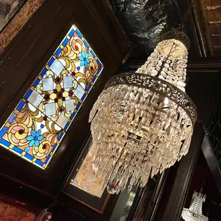 a chandelier and a stained glass window