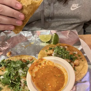 Shrimp tacos. My son was eating one. 3 to a plate with a yummy spicy dipping sauce