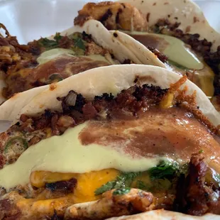 Tasty breakfast "el especial" tacos topped with verde and red salsa!