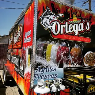 a food truck parked on the side of the road