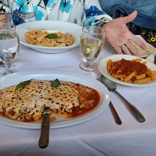 Rigatoni in vodka sauce and veal parmigiana with a side dish of penne in home-made marinara