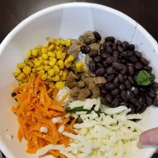 a person holding a bowl of food