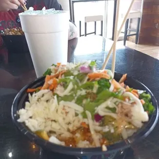 a woman eating a salad
