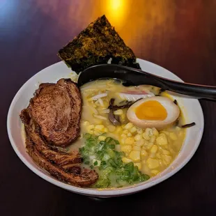 Chashu ramen with corn. Bamboo shoots held.