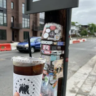 a person holding a cup of coffee