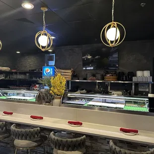 a sushi bar with chairs