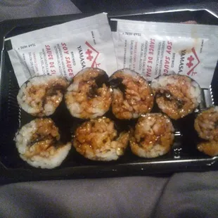 Unagi rolls. I did not touch these except to open the top... This is how they came! Worst rolled sushi I've ever seen.