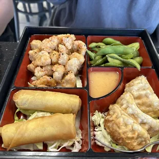 Chicken pop bento. Come with egg rolls and dumpling. Good.