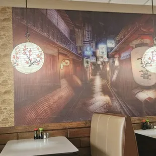 Interior of restaurant, very clean  with  booths and tables.