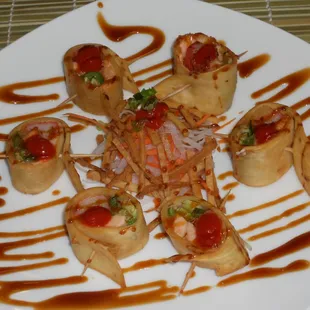 Mexican    
(salmon, crab, jalapeno, cucumber roll tortilla and deep fry, with sauce)