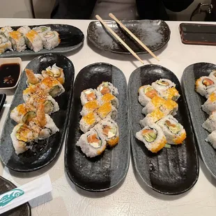 Rolls: California, Philadelphia, shrimp tempura, spicy tuna and one other one.