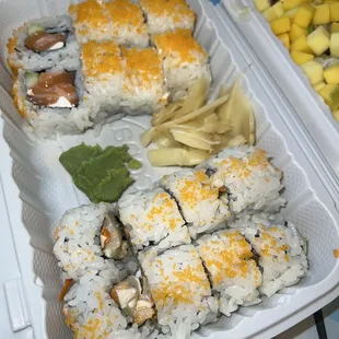 Philly roll on top and spicy scallop roll on the bottom