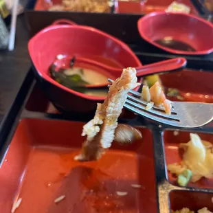 a plate of food with a fork sticking out of it