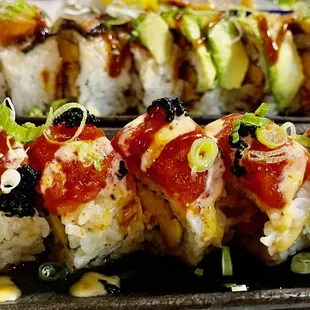 a plate of sushi rolls