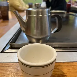 Pot of green tea with an adorable little cup