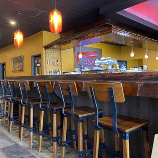 Seats with bar behind in