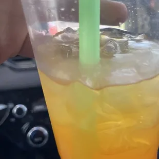 Mango tea with strawberry bubbles