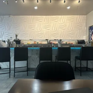 Sushi bar area with modern seating.