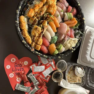 Party Tray C.  Not pictured is miso soup, Hibachi steak and chicken with veggies  or seasoned rice.